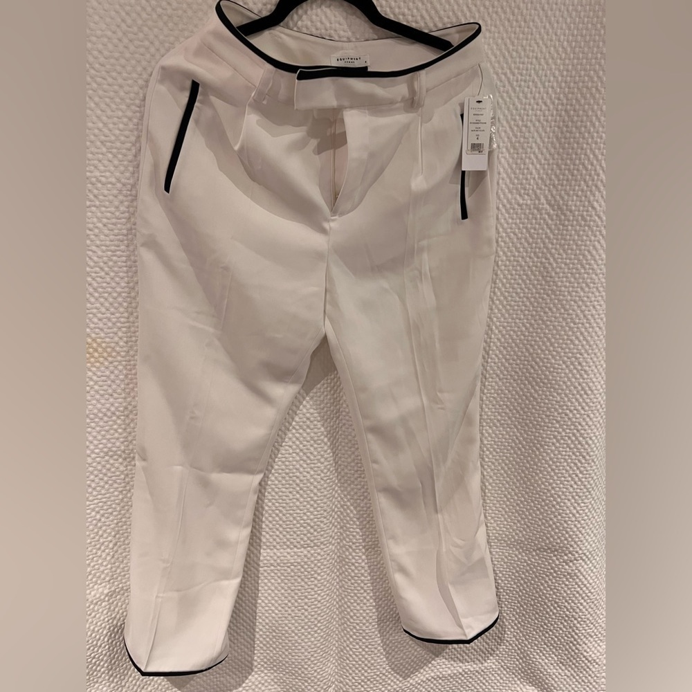 NWT woman’s designer white dress pants with black piping. Lined. Size 4.